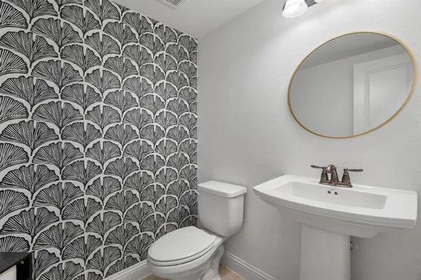 a bathroom with a toilet and a sink