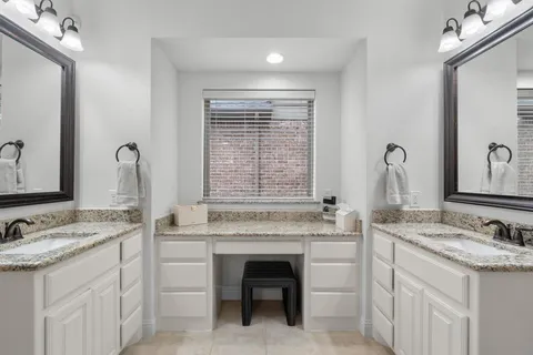 a bathroom with a sink and a window