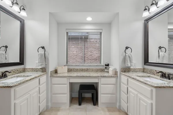 a bathroom with a sink and a window