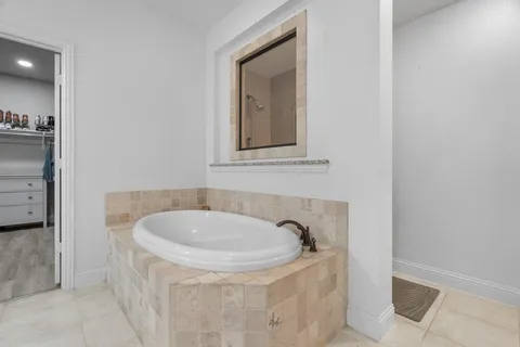 a bathroom with a tub and sink
