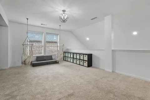 a view of an empty room with windows