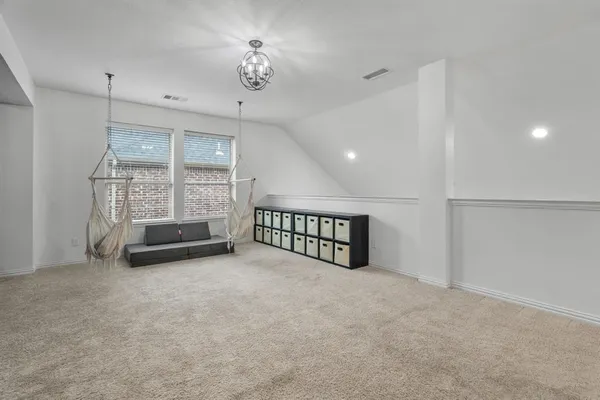 a view of an empty room with windows