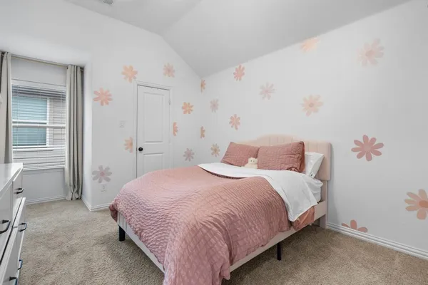 a bedroom with a bed and a cabinets