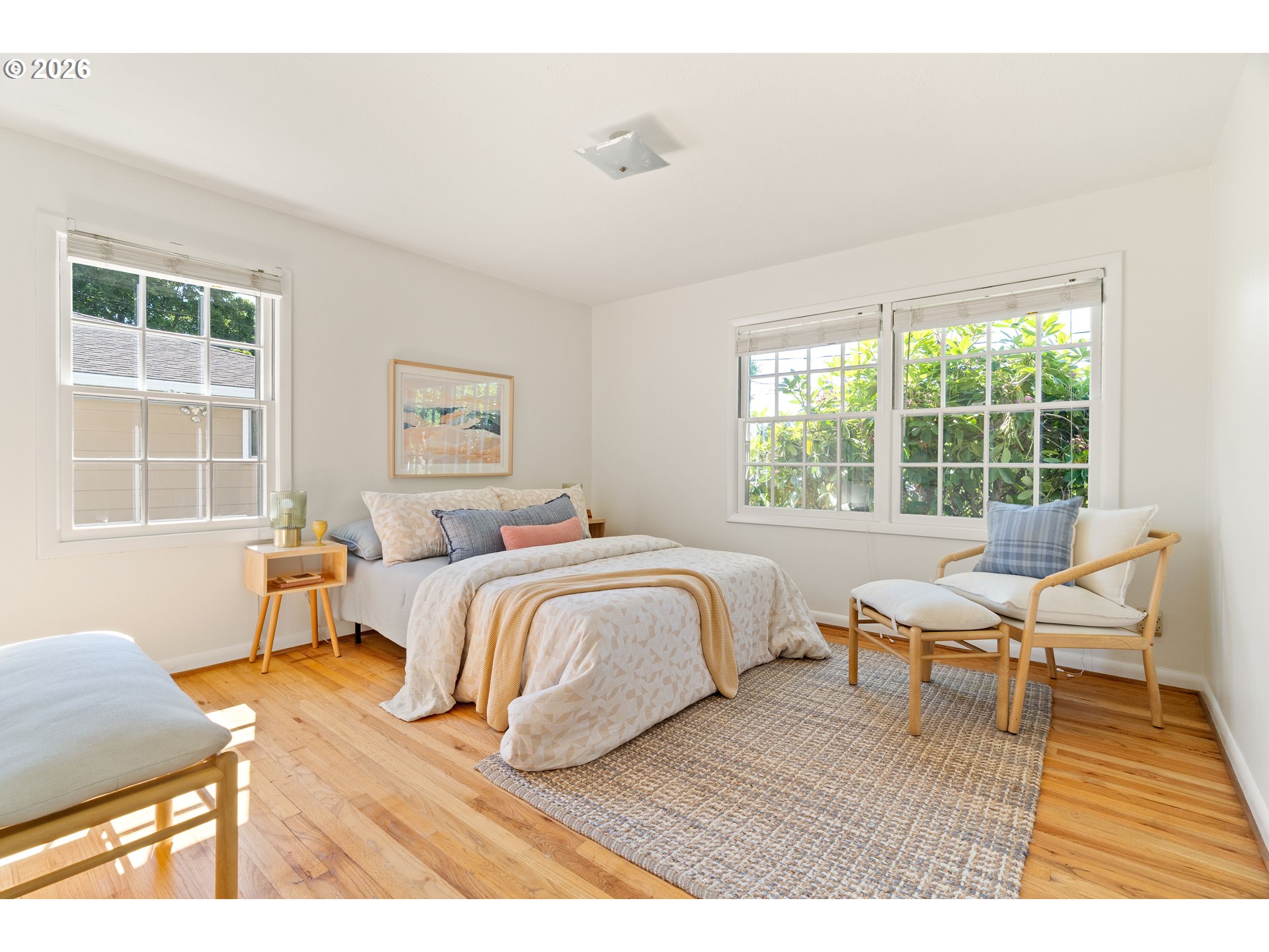 7541 Northeast Alameda Street Portland, OR 97213 - Photo 13 of 35 a bedroom with a bed and wooden floor