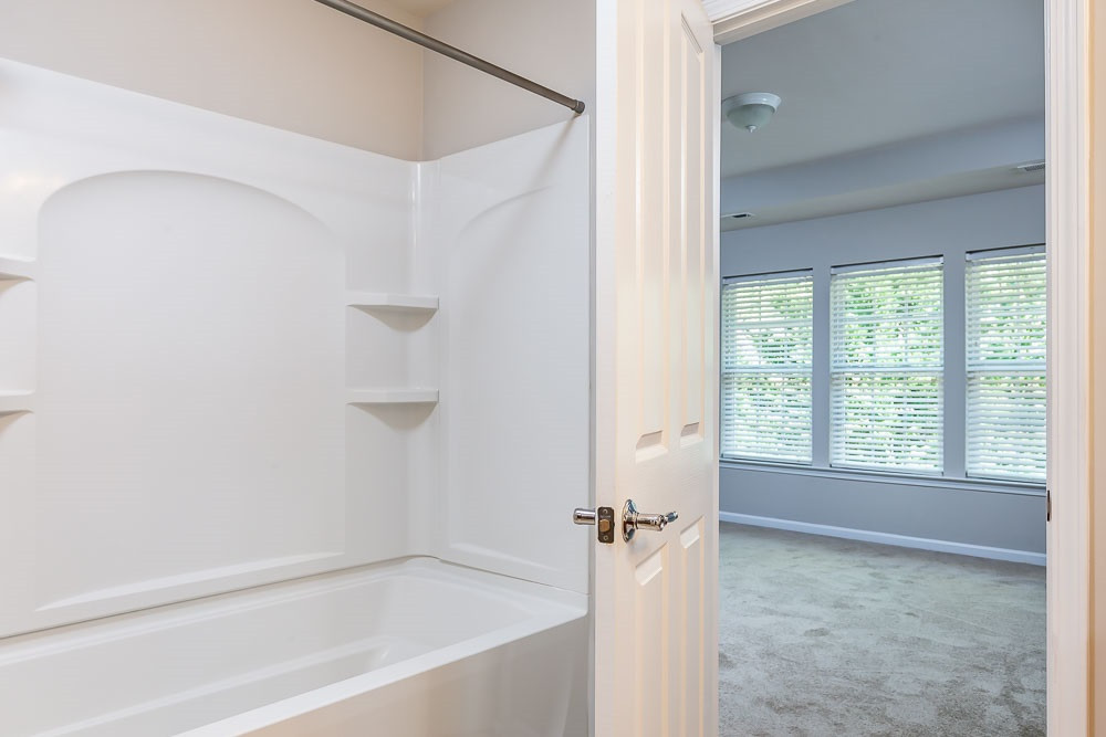 8722 Owl Roost Place Raleigh, NC 27617 - Photo 15 of 26 No glass walls to squeegee and scrub! Bring color and personal style with a well chosen curtain! Master Bath