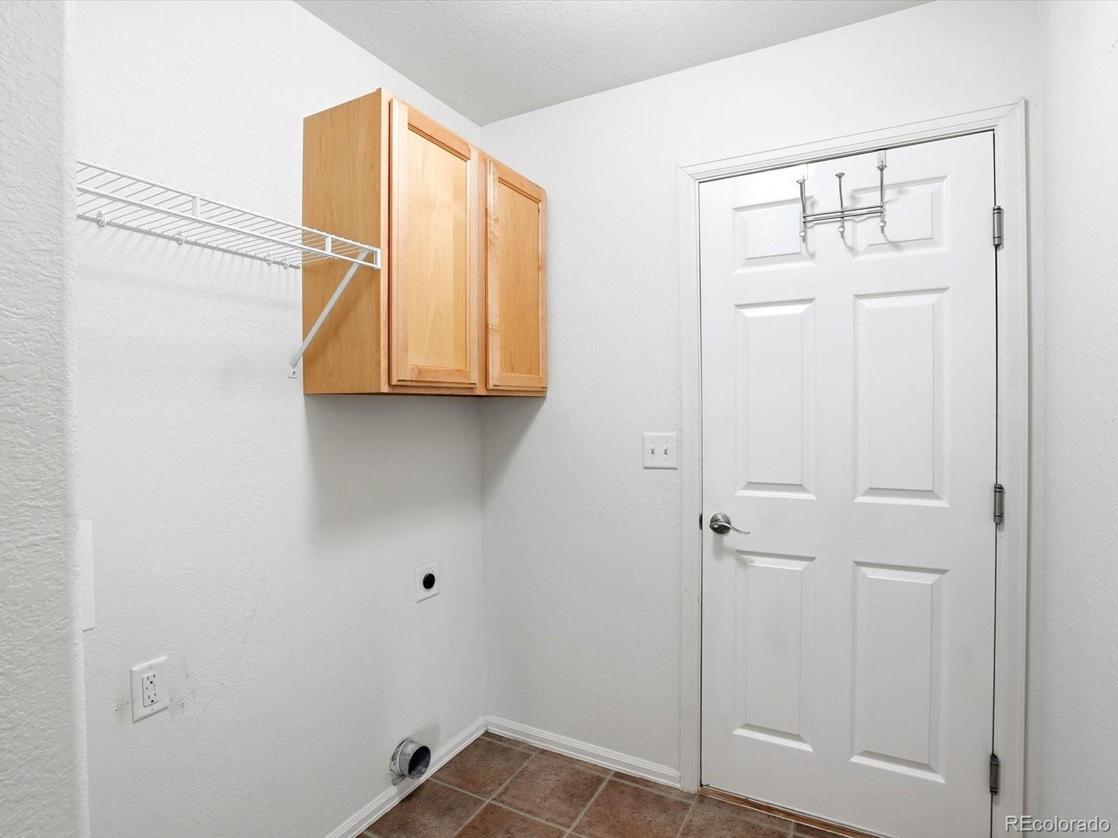 9720 Roadrunner Avenue Firestone, CO 80504 - Photo 20 of 46 a bathroom with a sink and cabinets