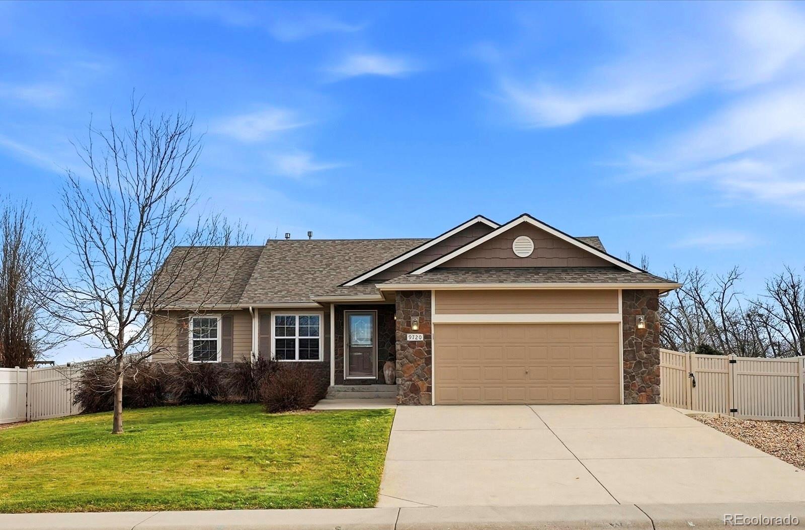 9720 Roadrunner Avenue Firestone, CO 80504 - Photo 2 of 46 a front view of a house with a yard