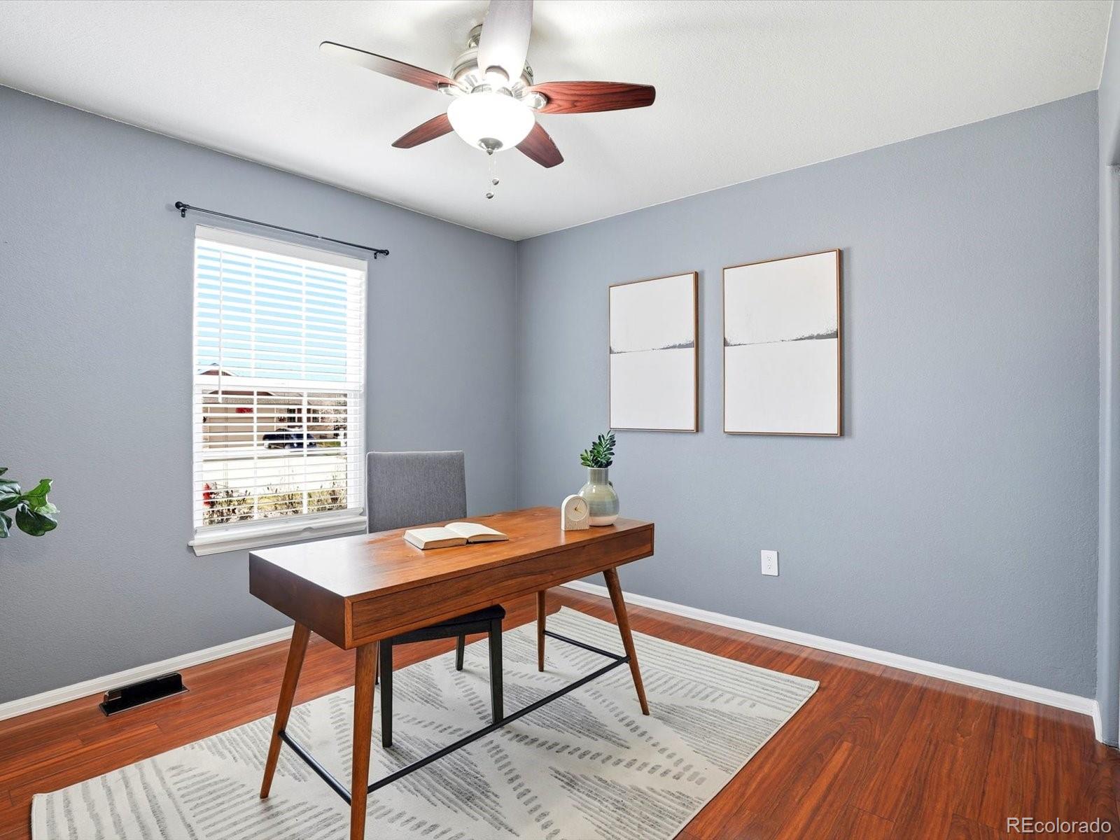 9720 Roadrunner Avenue Firestone, CO 80504 - Photo 21 of 46 a workspace with wooden floor