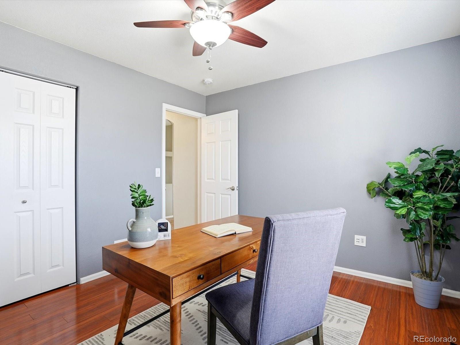 9720 Roadrunner Avenue Firestone, CO 80504 - Photo 22 of 46 a view of a dining room with furniture and wooden floor