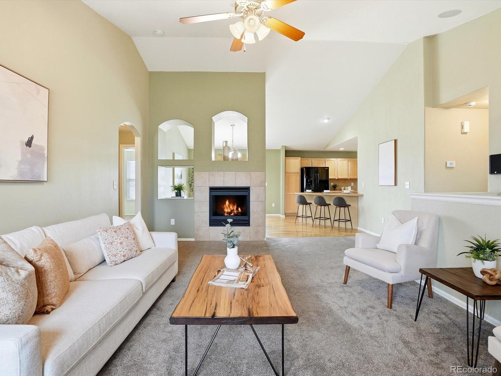 9720 Roadrunner Avenue Firestone, CO 80504 - Photo 4 of 46 a living room with furniture and a fireplace