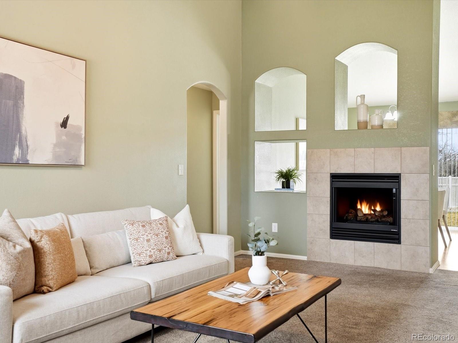 9720 Roadrunner Avenue Firestone, CO 80504 - Photo 5 of 46 a living room with furniture and a fireplace