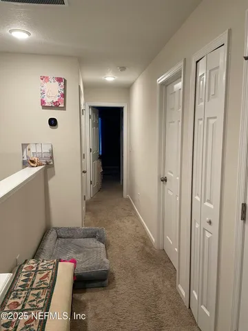 a hallway with toys and wooden floor