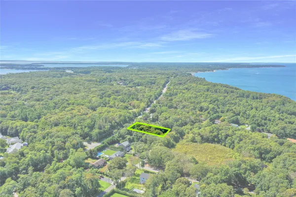 an aerial view of a houses with a yard
