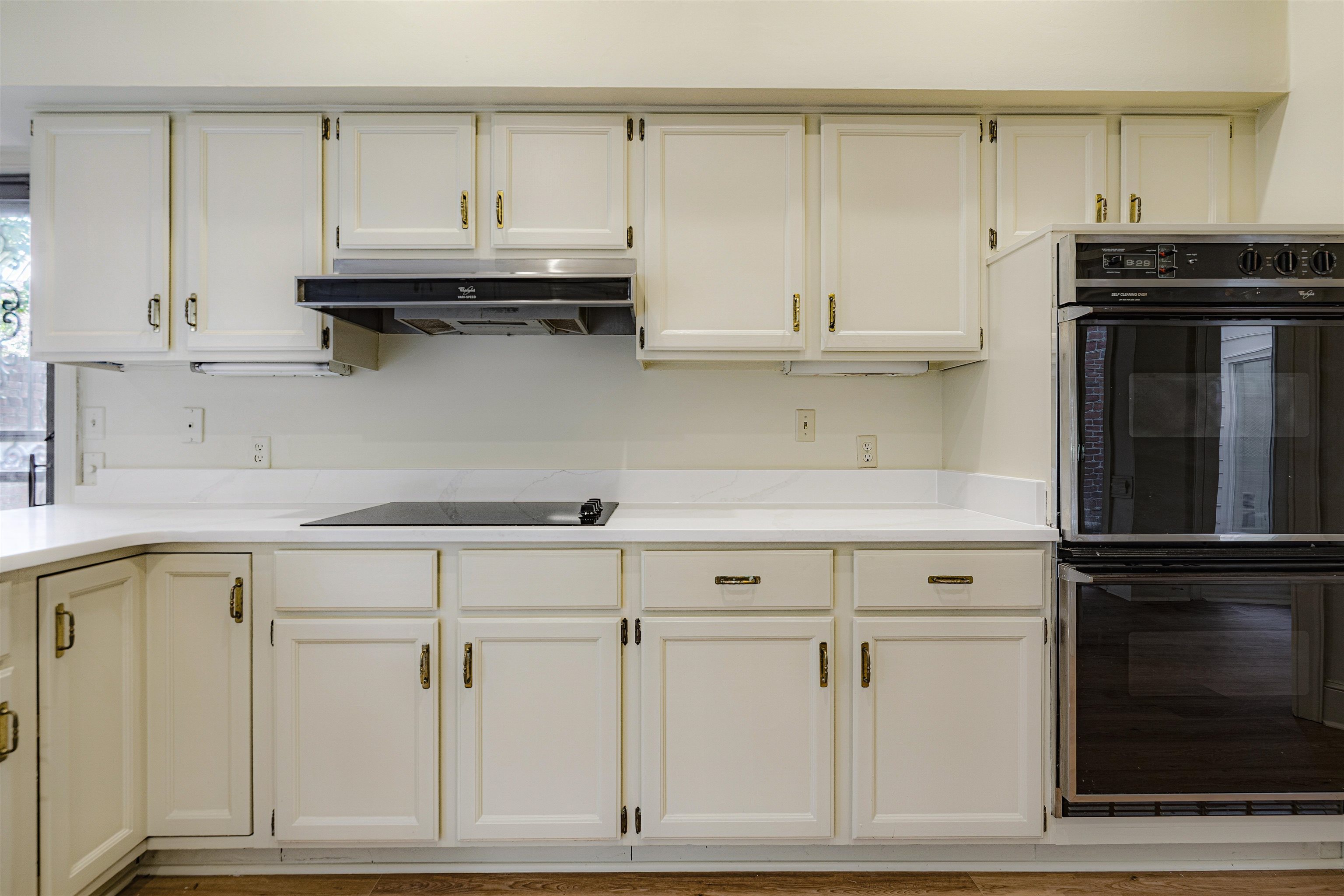 478 West Racquet Club Place Memphis, TN 38117 - Photo 13 of 39 a kitchen with white cabinets and a sink