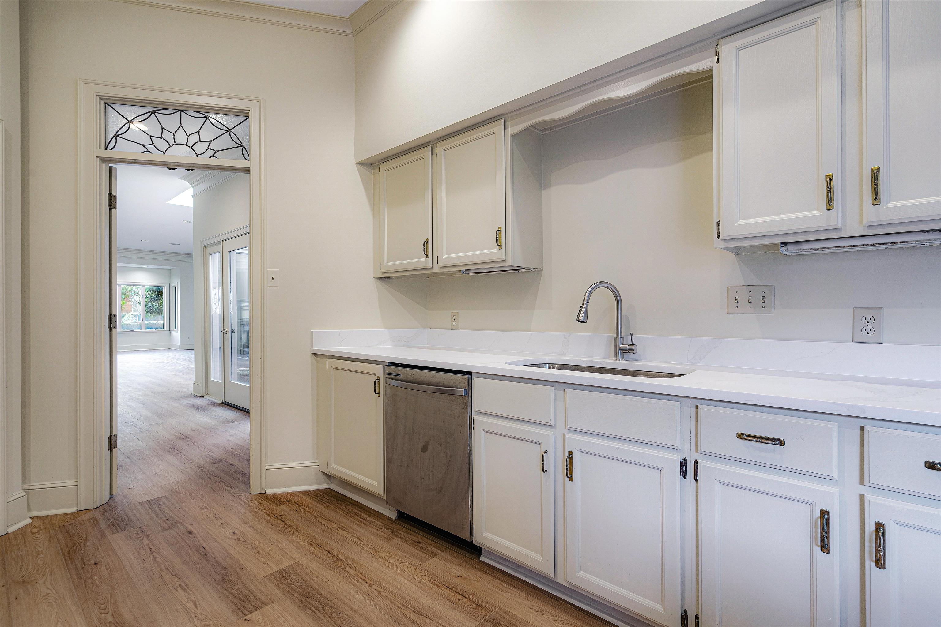 478 West Racquet Club Place Memphis, TN 38117 - Photo 14 of 39 a kitchen with a sink cabinets and wooden floor