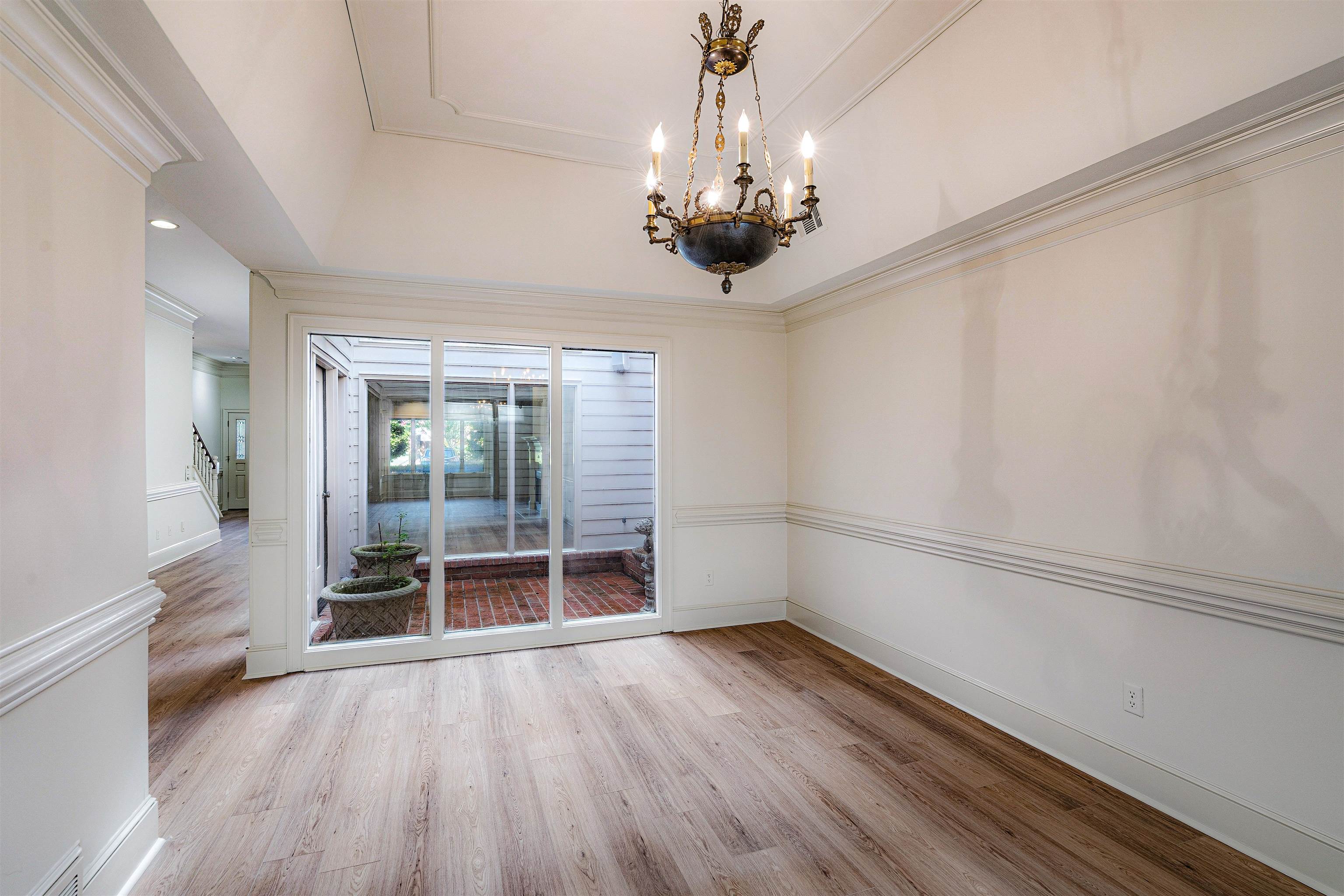 478 West Racquet Club Place Memphis, TN 38117 - Photo 17 of 39 wooden floor in an empty room with a window