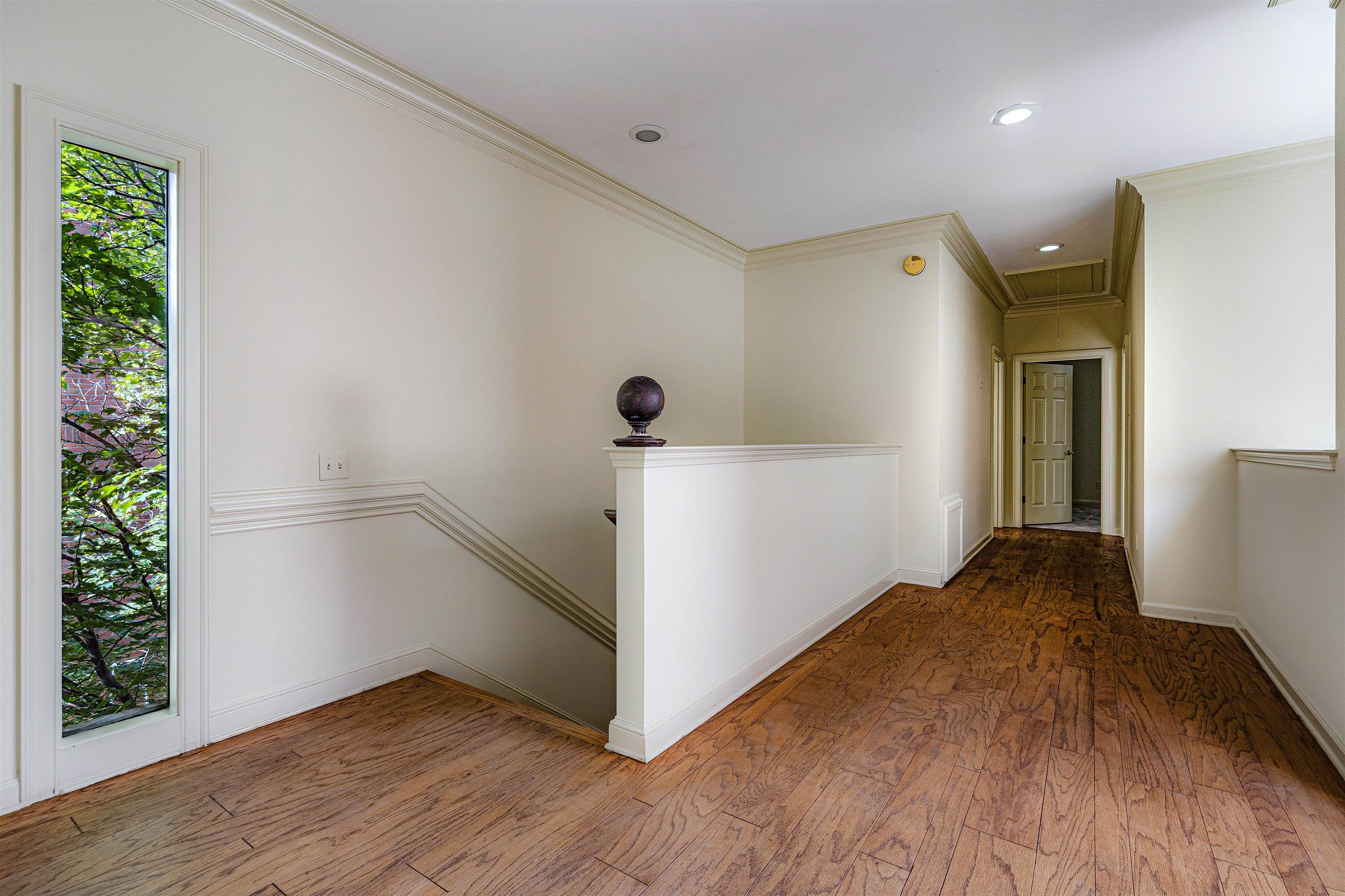 478 West Racquet Club Place Memphis, TN 38117 - Photo 18 of 39 a view of a room with wooden floor and a window