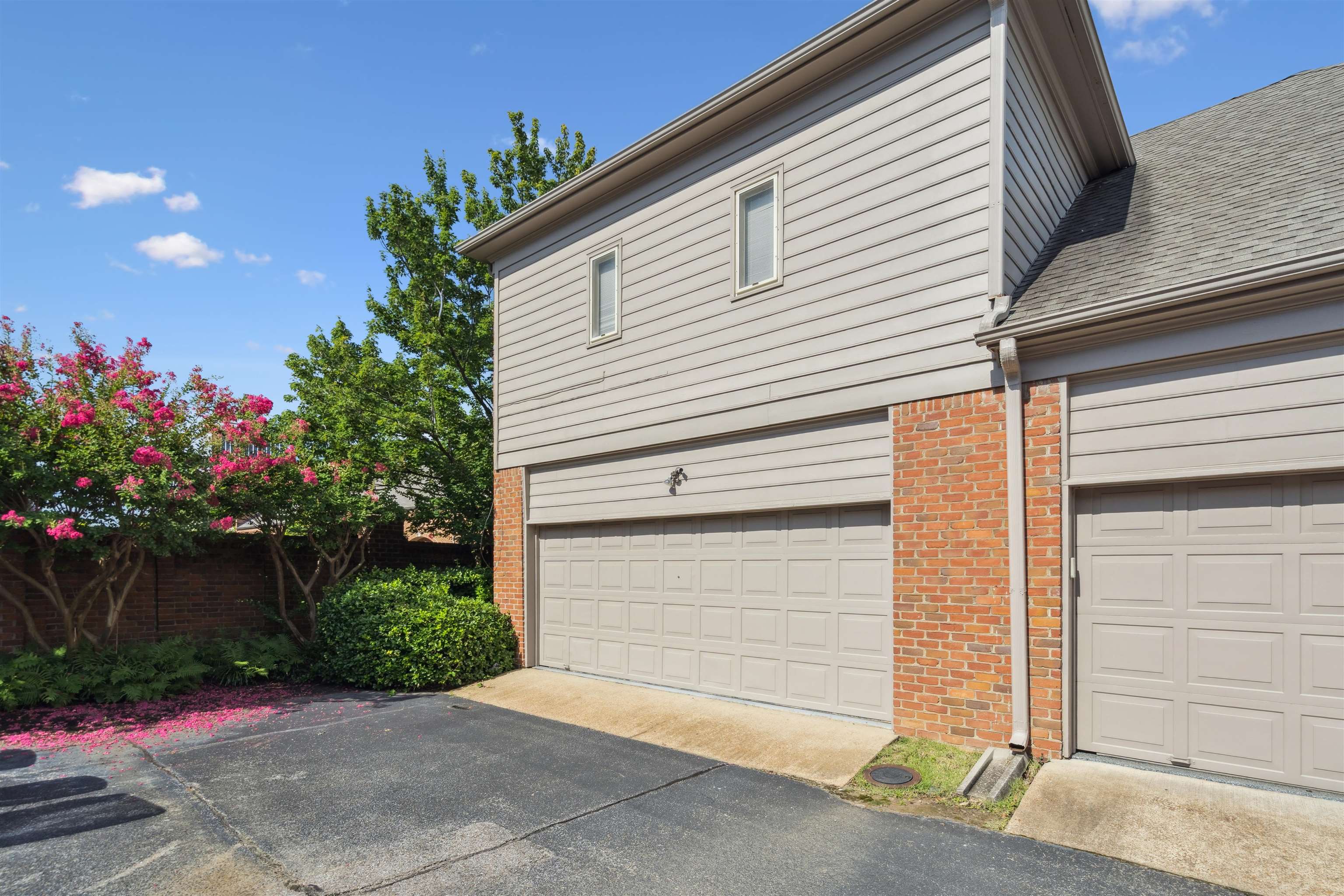478 West Racquet Club Place Memphis, TN 38117 - Photo 39 of 39 a small white house with a flower garden in front of it