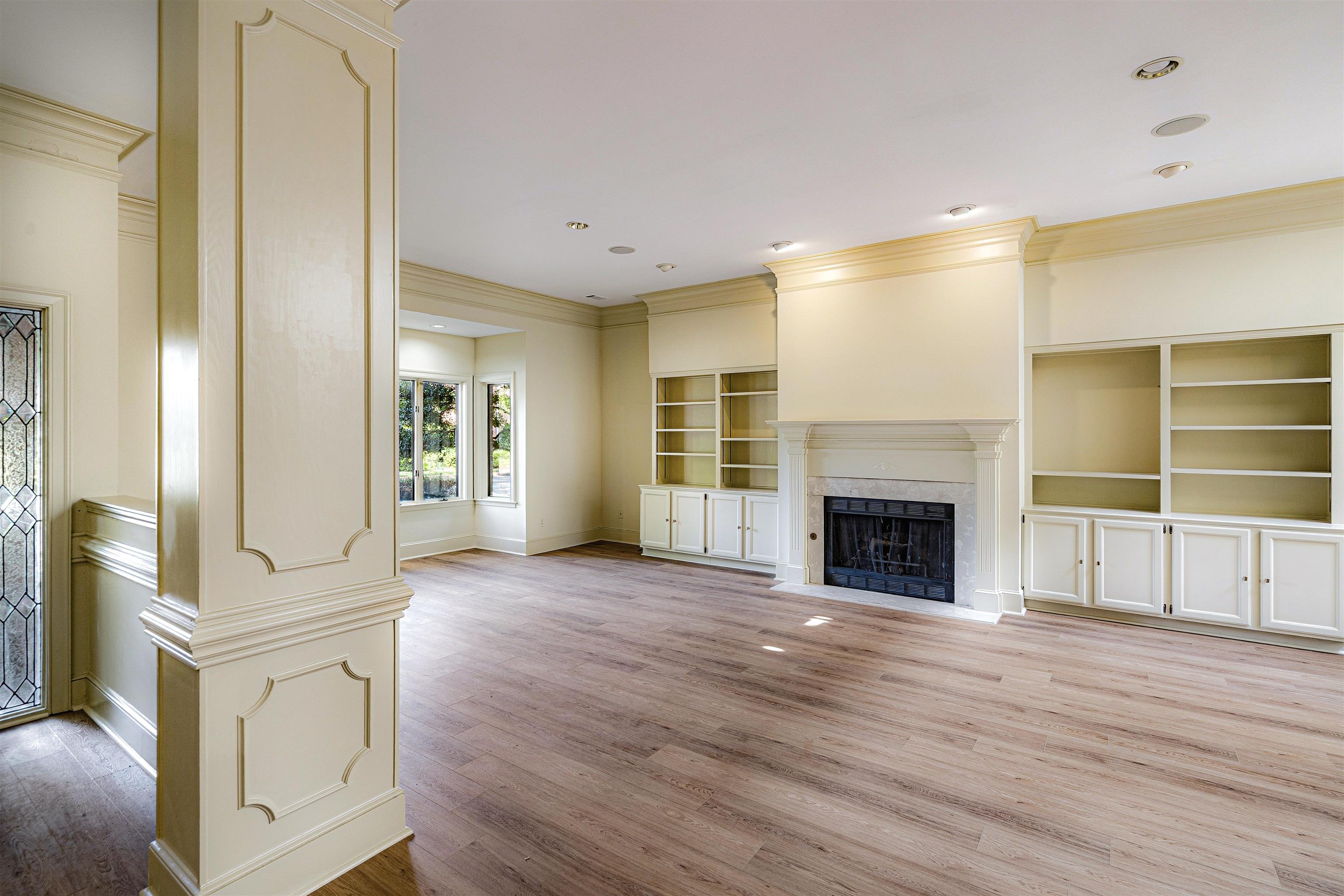 478 West Racquet Club Place Memphis, TN 38117 - Photo 5 of 39 a view of a livingroom with wooden floor and fireplace