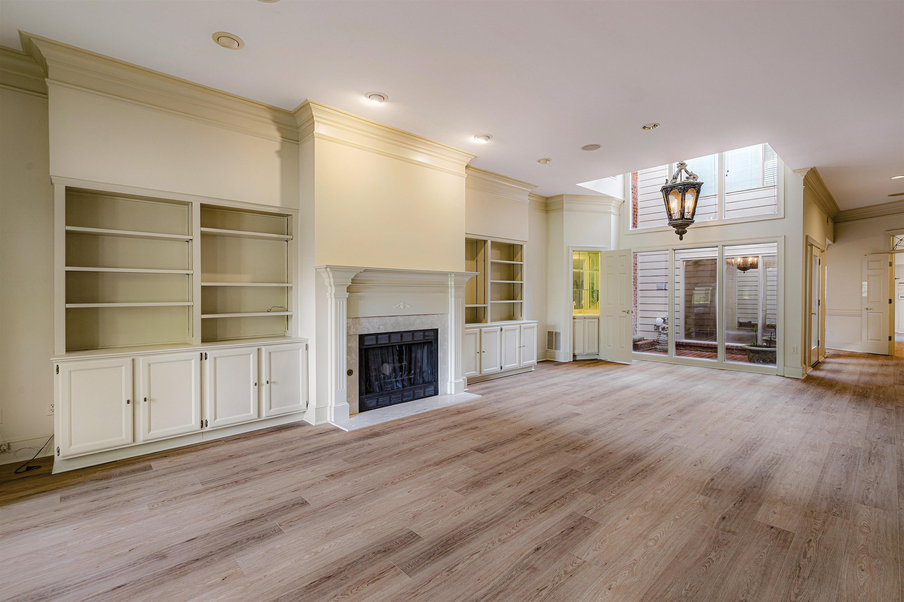 478 West Racquet Club Place Memphis, TN 38117 - Photo 9 of 39 a view of an empty room with a fireplace and a window
