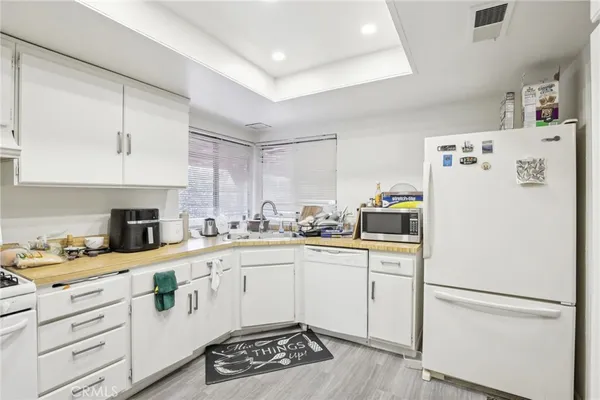 a kitchen with a stove a sink and a microwave