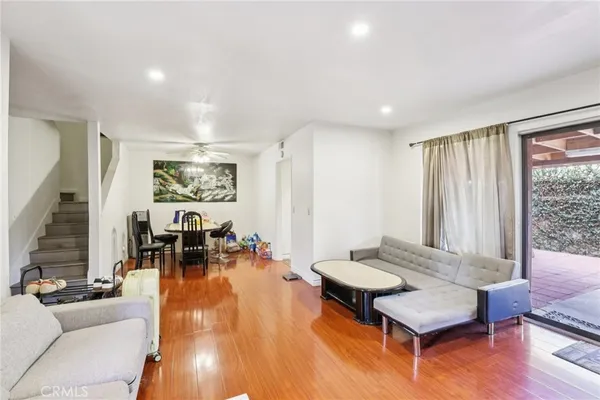 a bedroom with a bed and a couch