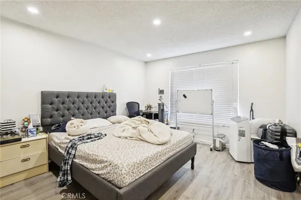 a bedroom with a bed and a couch