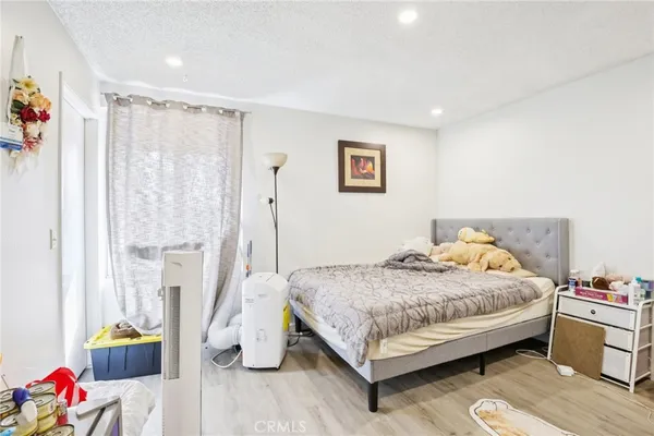 a very nice looking room with wooden floor and furniture