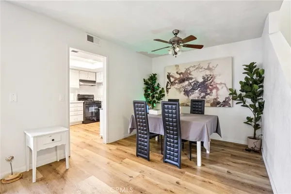 a view of a livingroom with furniture and a potted plant