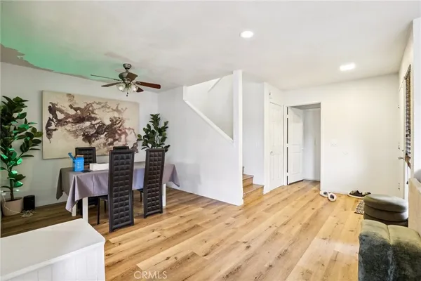 a bedroom with furniture and wooden floor