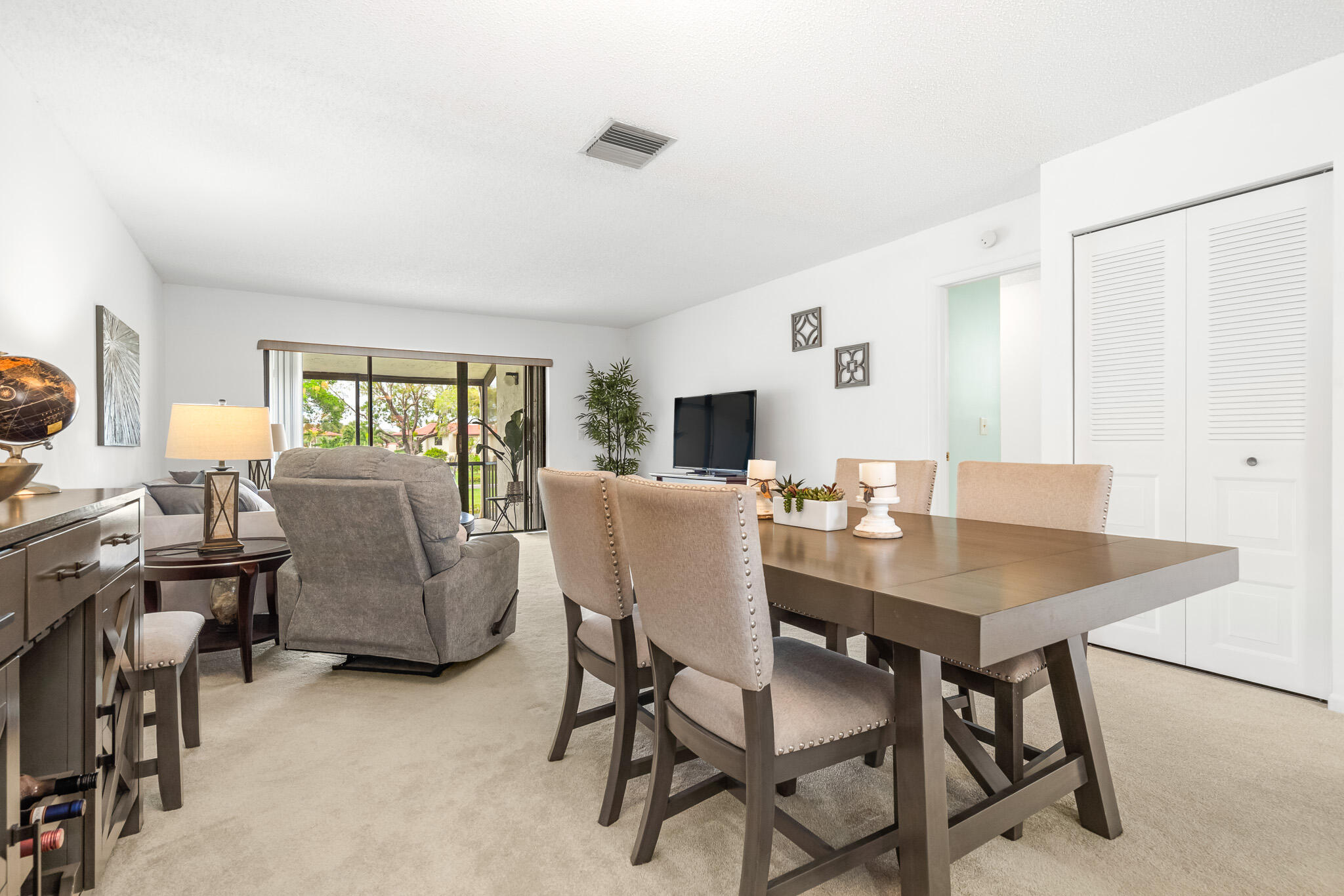 21218 Lago Circle, Unit F Boca Raton, FL 33433 - Photo 17 of 40 a view of a dining room with furniture and a livingroom