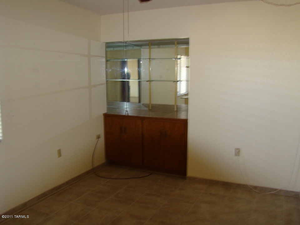 1443 North Rio-Aros Green Valley, AZ 85614 - Photo 8 of 19 an empty room with mirror