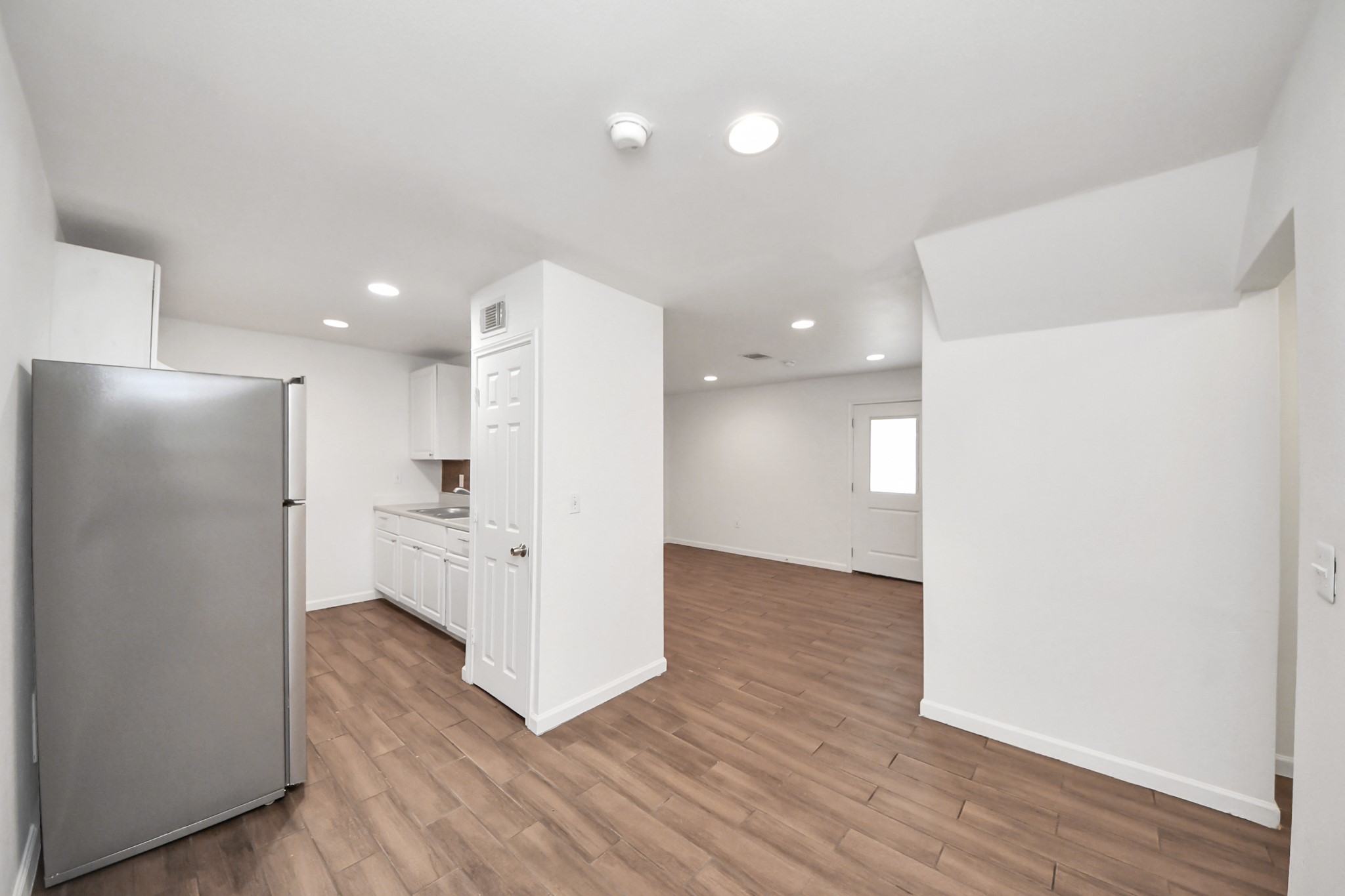 12068 Beechnut Street, Unit C Houston, TX 77072 - Photo 12 of 40 a view of a kitchen with a refrigerator and a stove