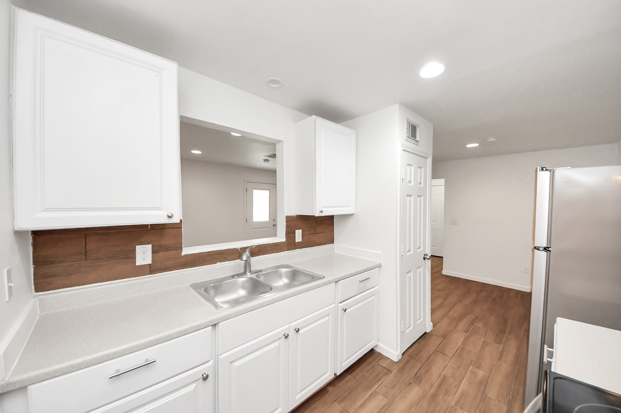 12068 Beechnut Street, Unit C Houston, TX 77072 - Photo 17 of 40 a bathroom with a sink a mirror a vanity and a shower