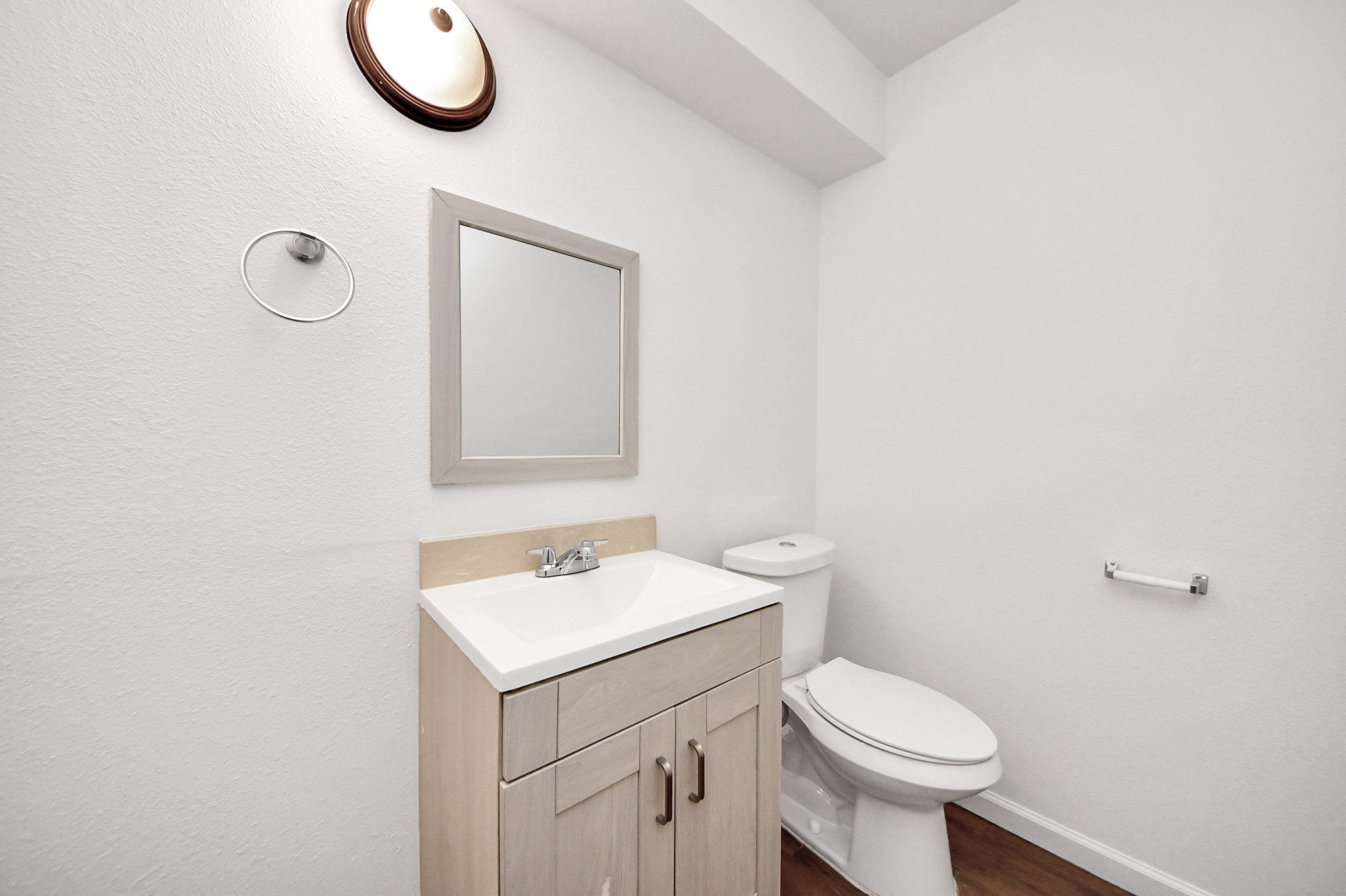 12068 Beechnut Street, Unit C Houston, TX 77072 - Photo 19 of 40 a bathroom with a sink mirror vanity and toilet