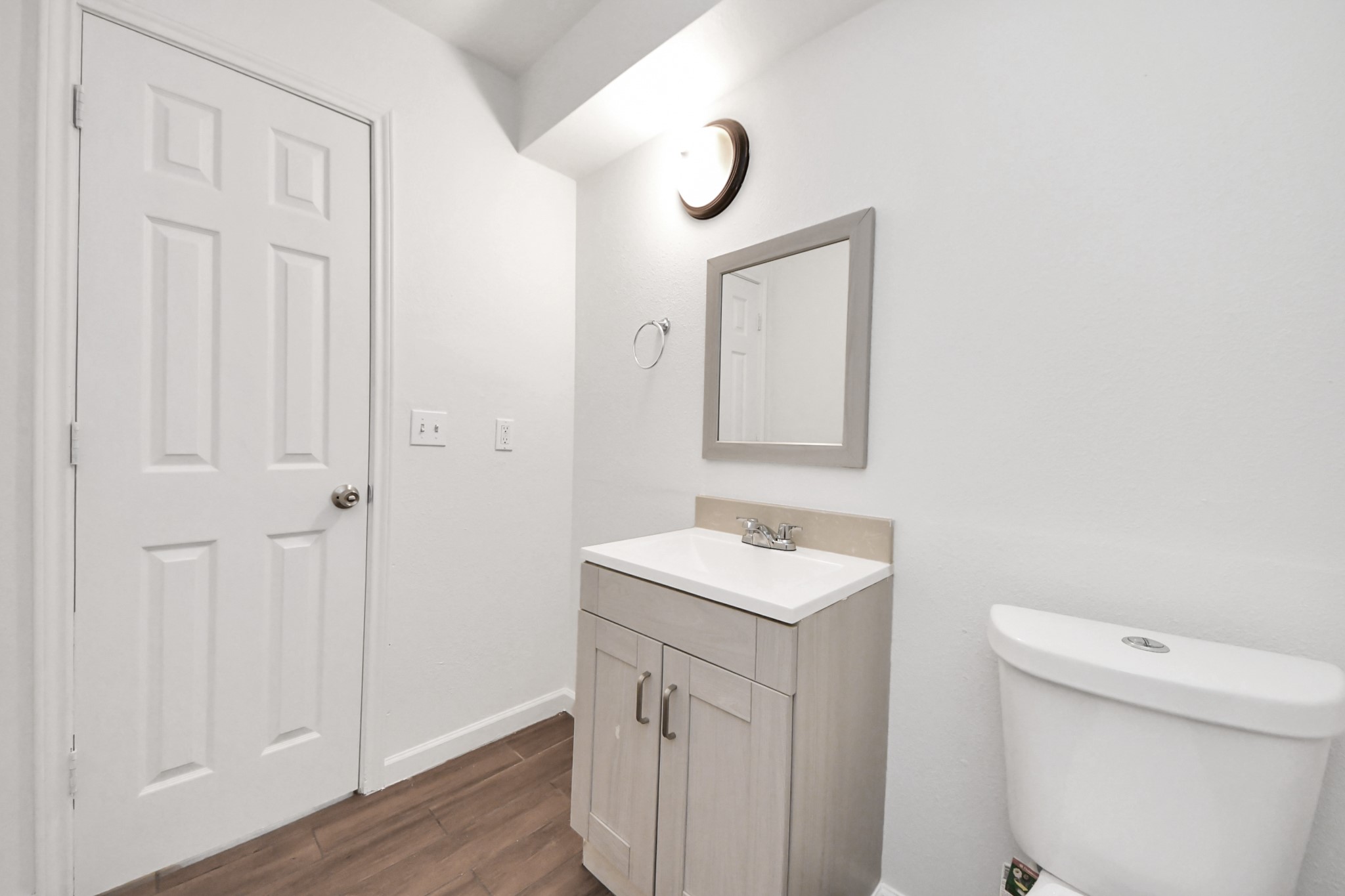 12068 Beechnut Street, Unit C Houston, TX 77072 - Photo 20 of 40 a bathroom with a sink a toilet and a mirror