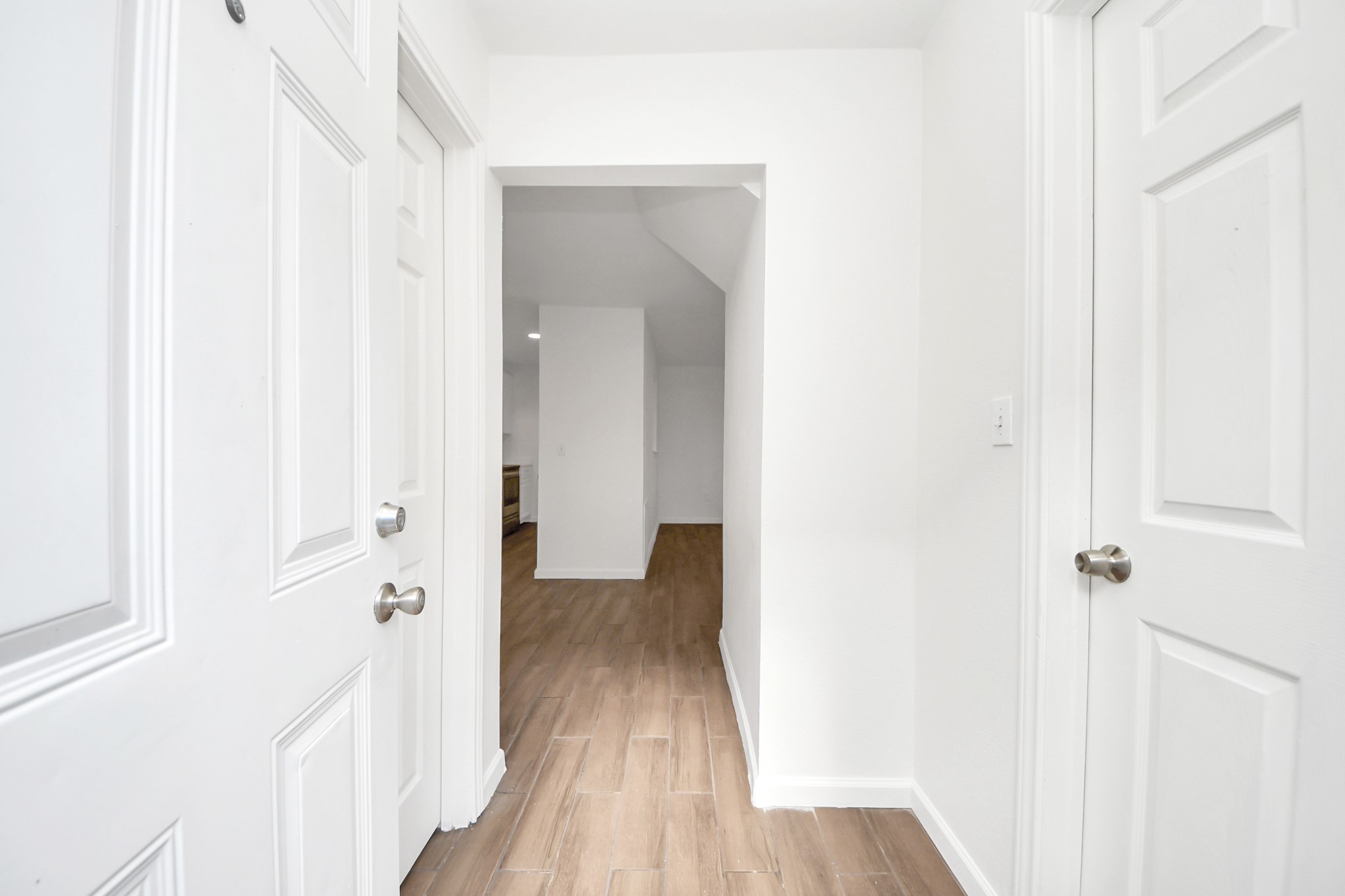 12068 Beechnut Street, Unit C Houston, TX 77072 - Photo 22 of 40 a view of a hallway with wooden floor