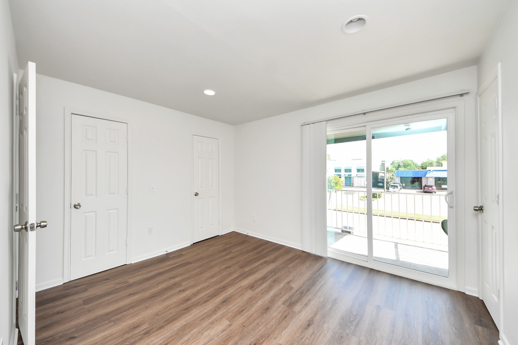 12068 Beechnut Street, Unit C Houston, TX 77072 - Photo 25 of 40 a view of wooden floor and windows in a room
