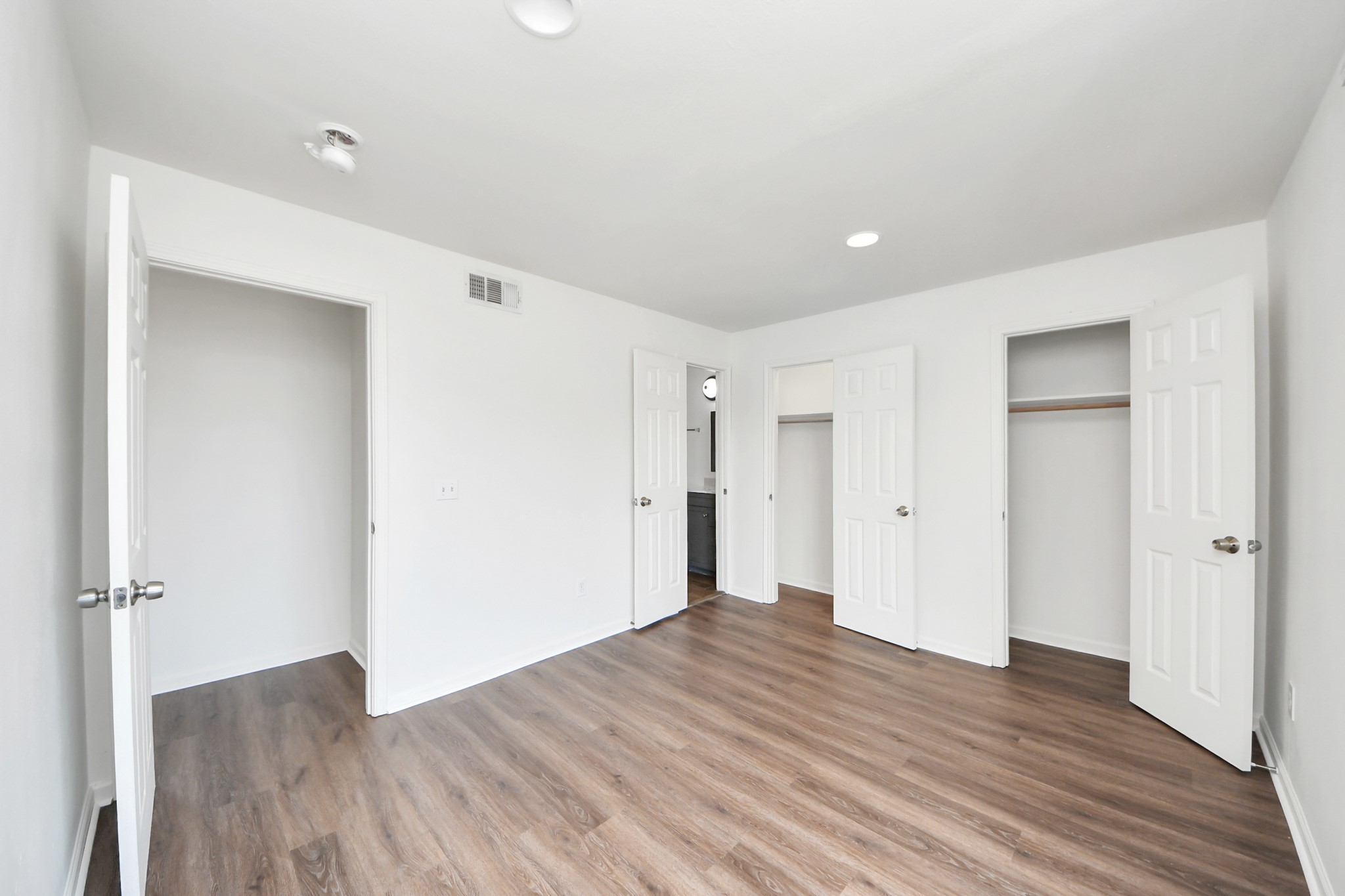12068 Beechnut Street, Unit C Houston, TX 77072 - Photo 26 of 40 a view of a big room with wooden floor and windows