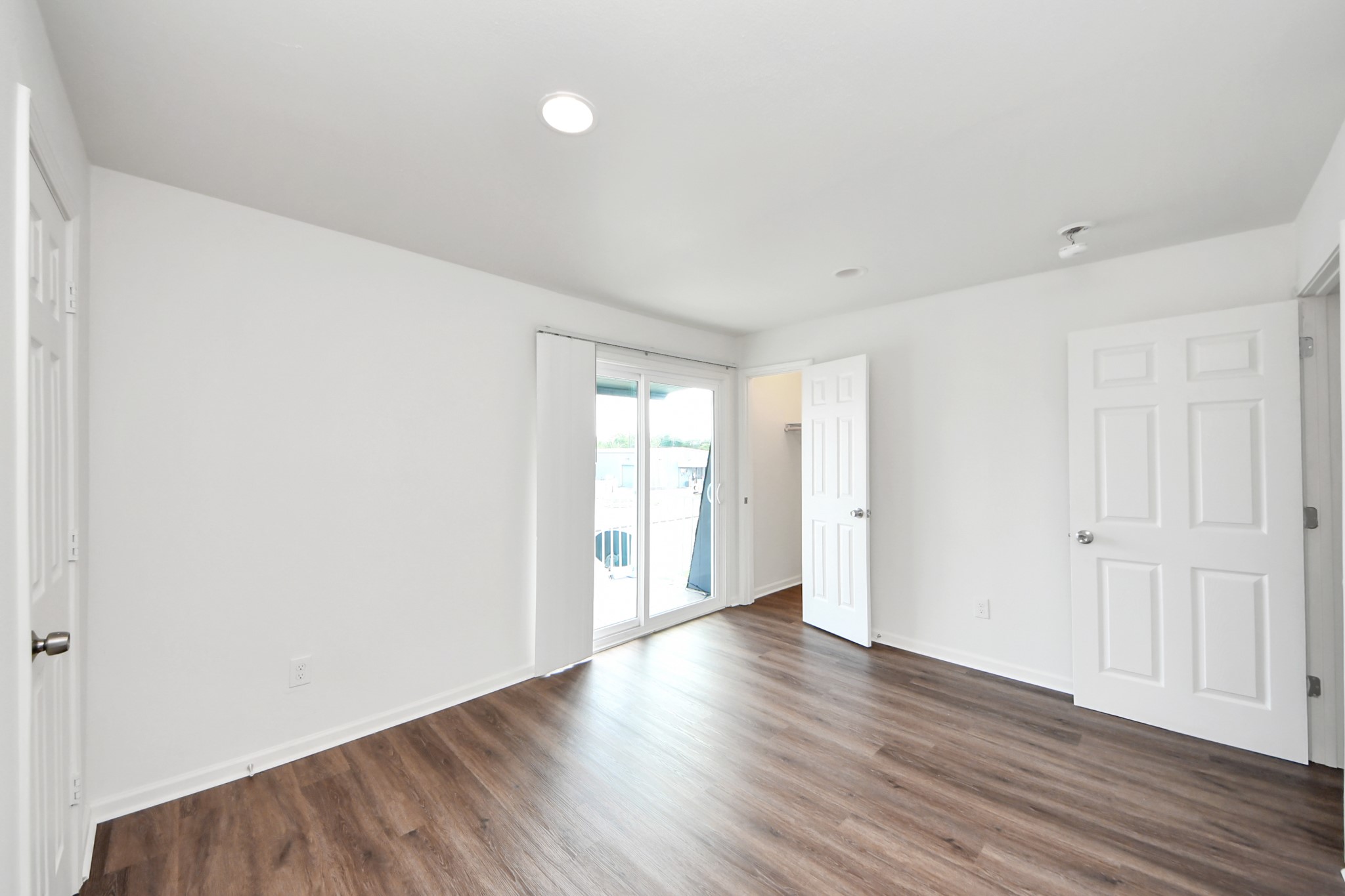 12068 Beechnut Street, Unit C Houston, TX 77072 - Photo 27 of 40 a view of an empty room with wooden floor and closet