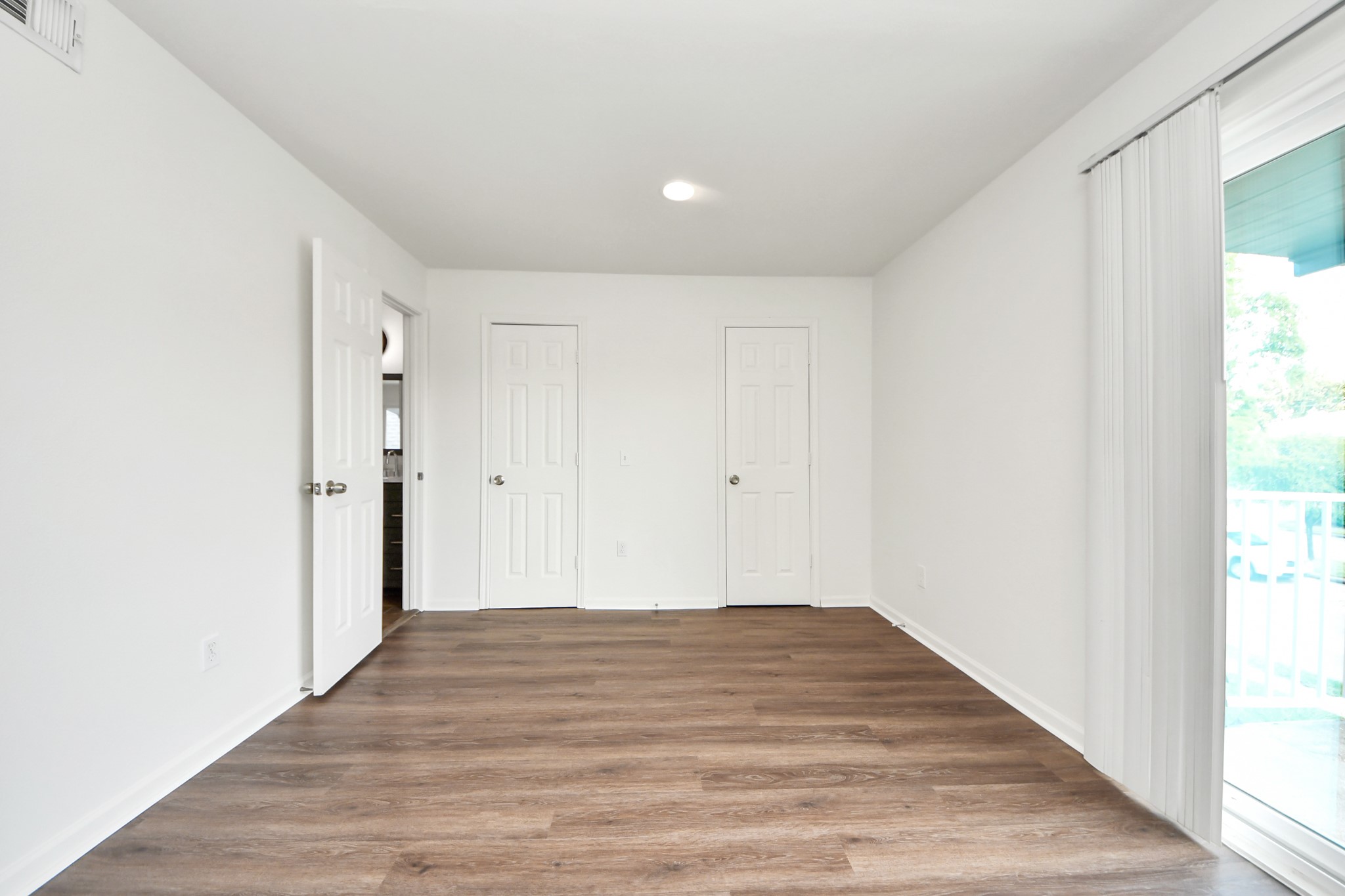 12068 Beechnut Street, Unit C Houston, TX 77072 - Photo 28 of 40 a view of a room with wooden floor and a hallway