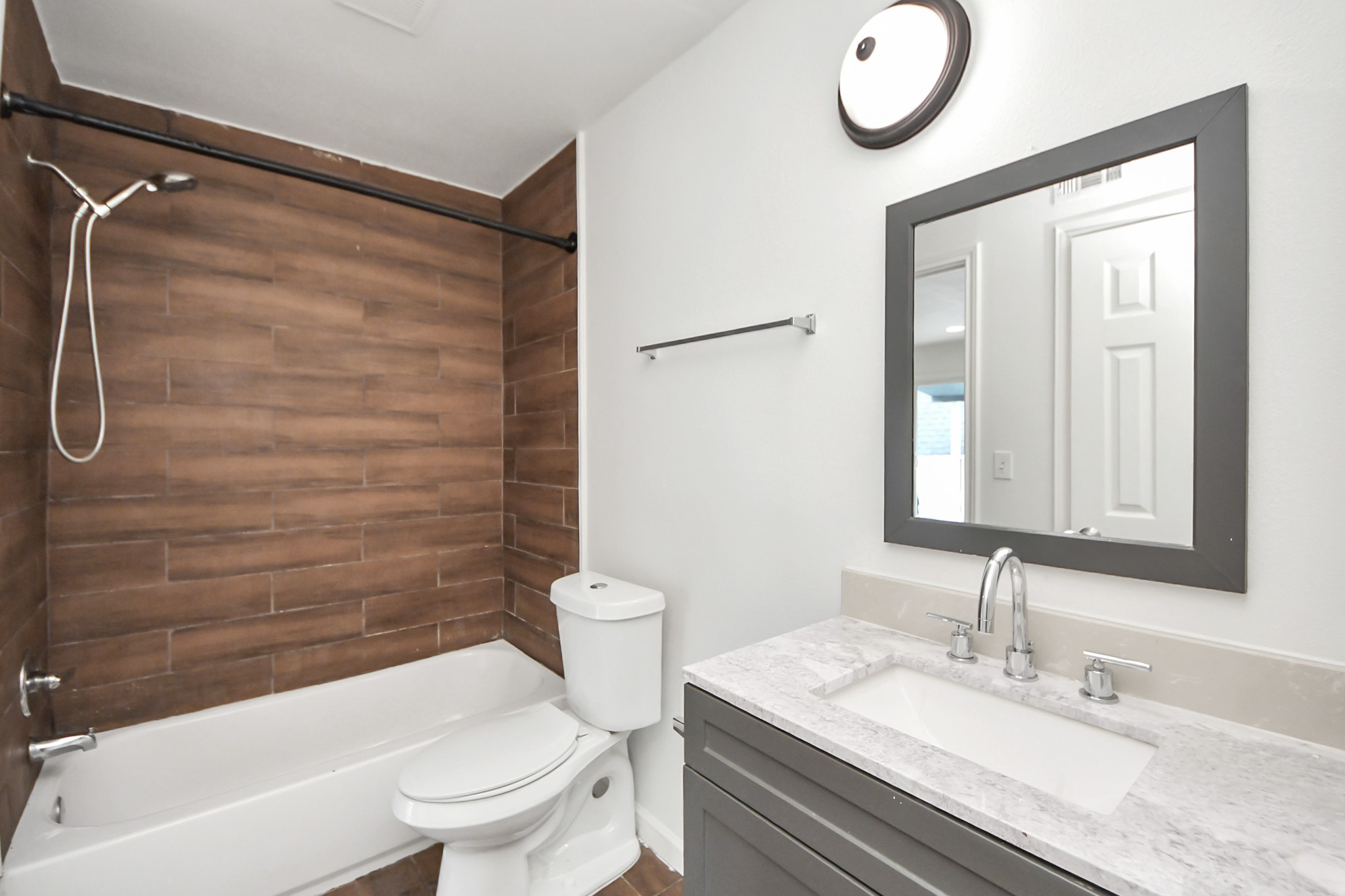 12068 Beechnut Street, Unit C Houston, TX 77072 - Photo 29 of 40 a bathroom with a sink a toilet and a shower