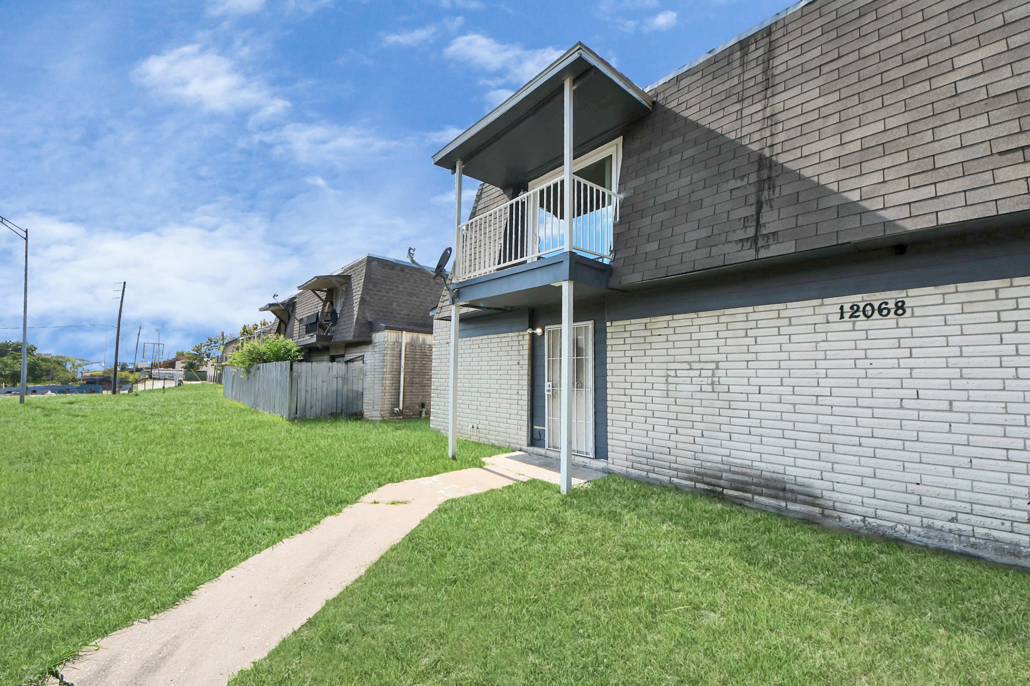 12068 Beechnut Street, Unit C Houston, TX 77072 - Photo 3 of 40 a house with green field in front of it
