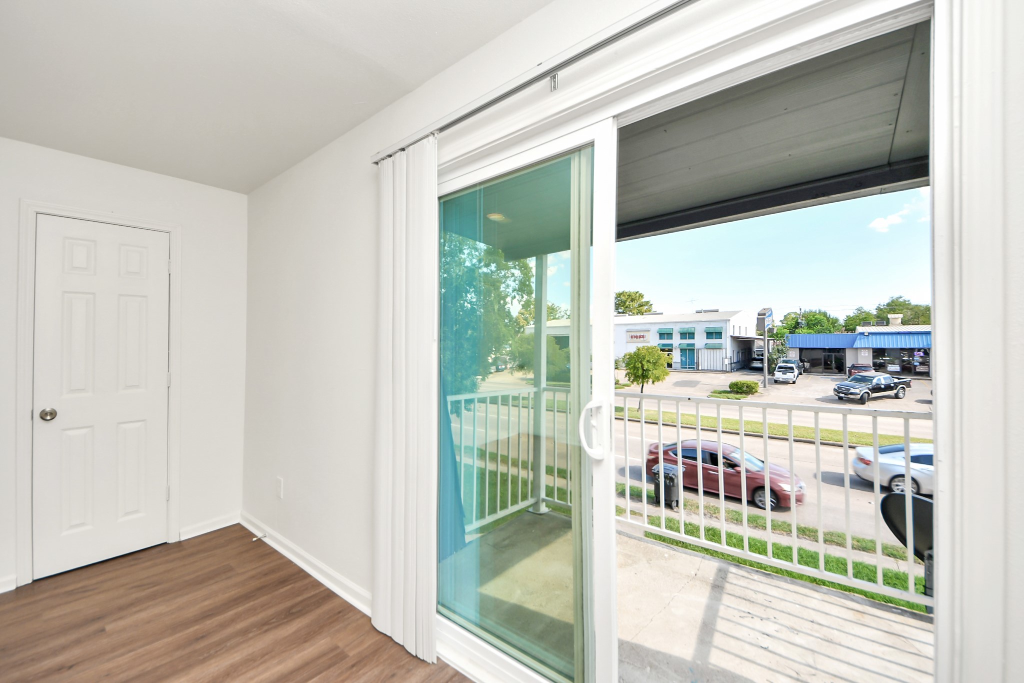 12068 Beechnut Street, Unit C Houston, TX 77072 - Photo 31 of 40 a view of a balcony with wooden floor