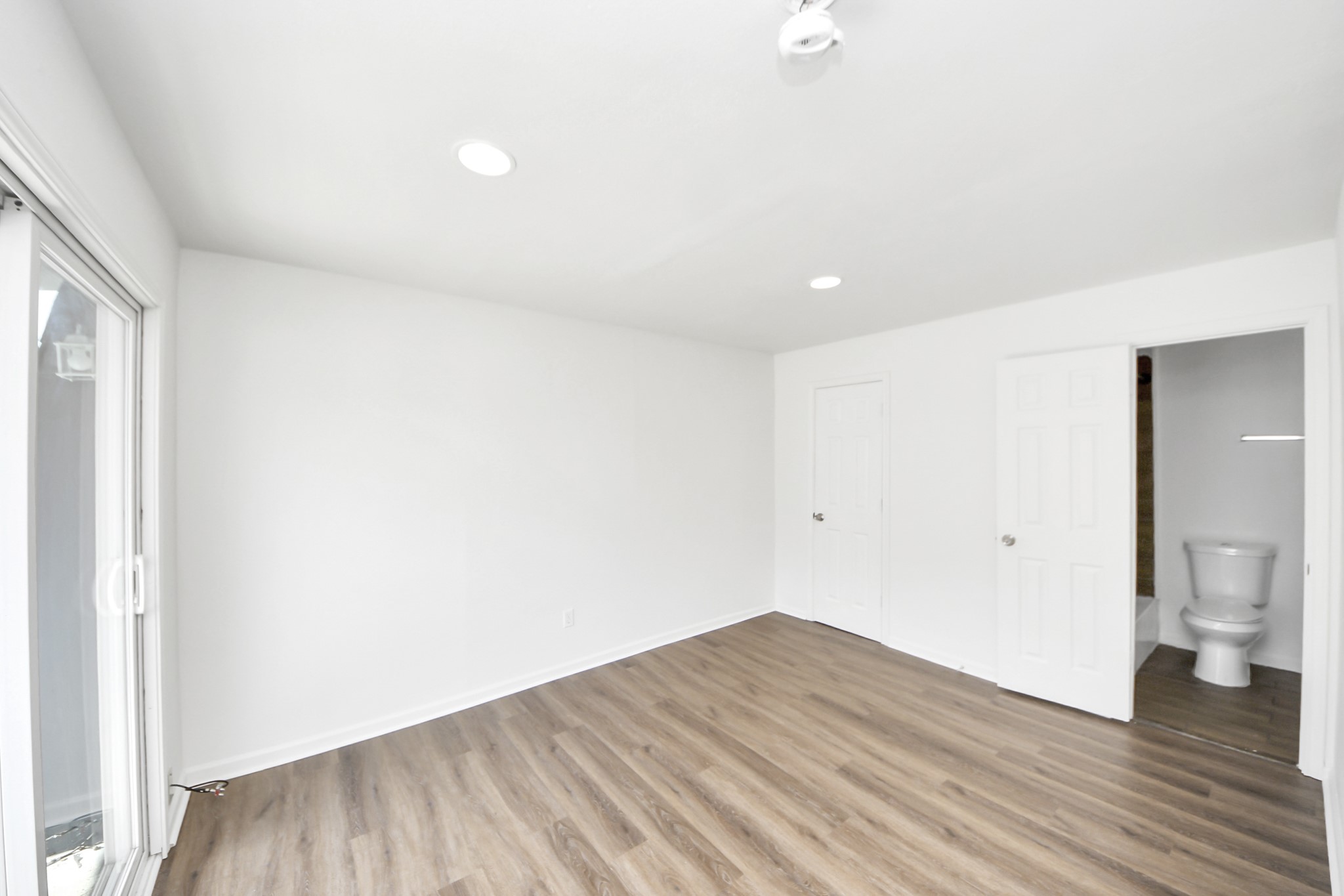 12068 Beechnut Street, Unit C Houston, TX 77072 - Photo 33 of 40 a view of a big room with wooden floor and bathroom