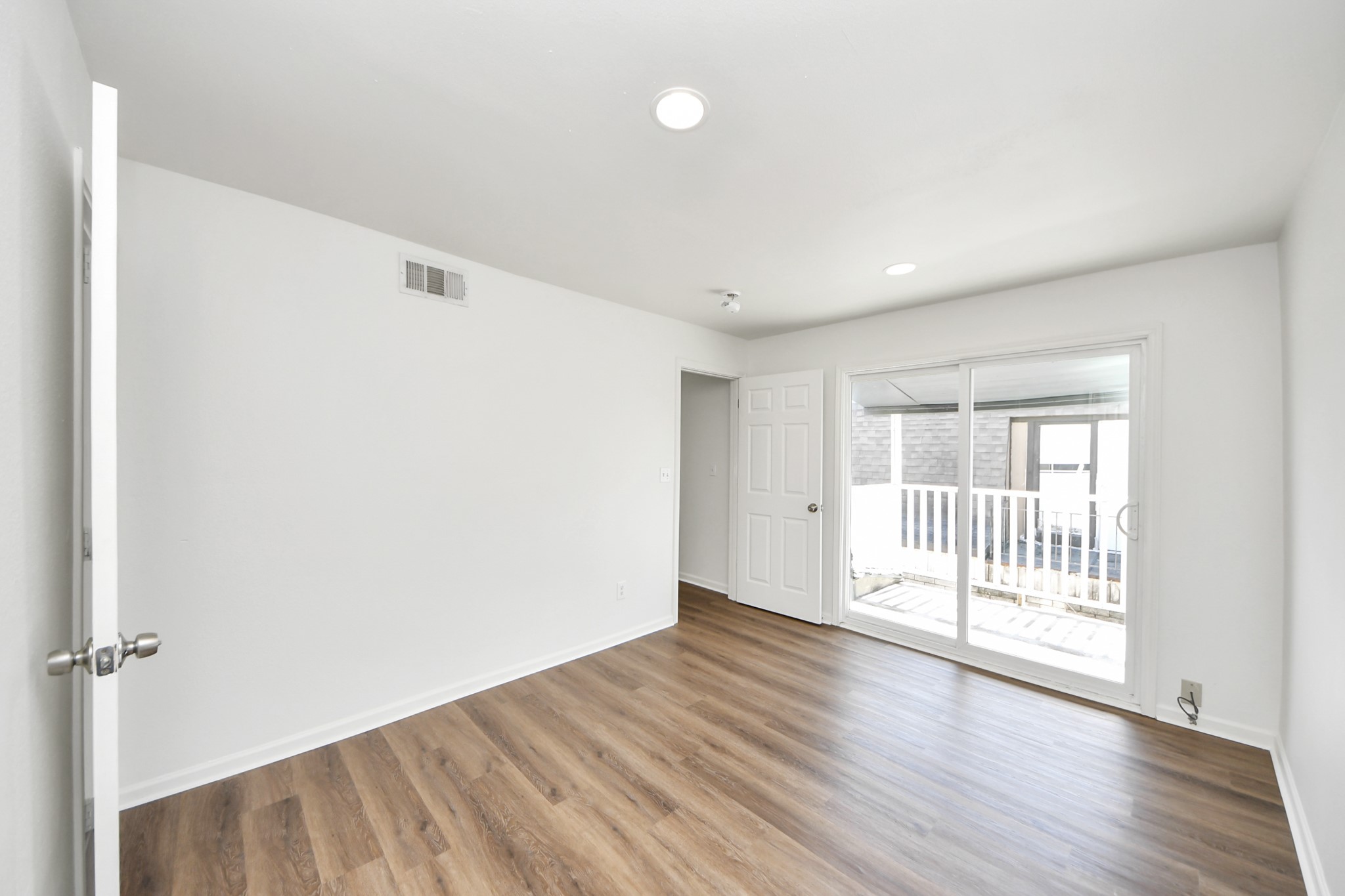 12068 Beechnut Street, Unit C Houston, TX 77072 - Photo 34 of 40 wooden floor in an empty room with a window