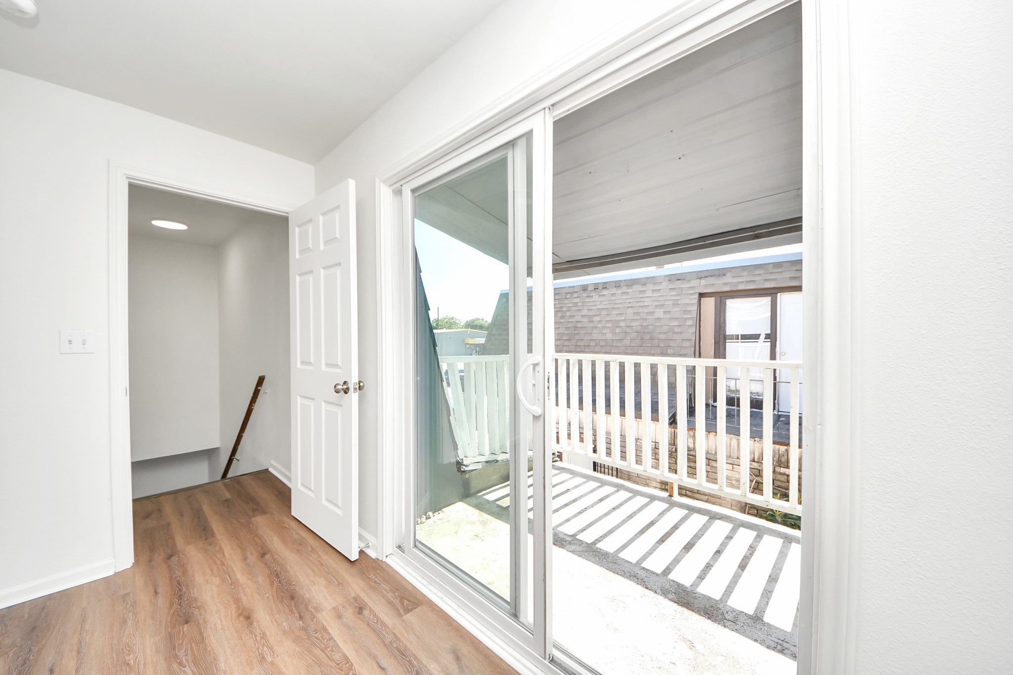 12068 Beechnut Street, Unit C Houston, TX 77072 - Photo 37 of 40 a view of a room with wooden floor and windows