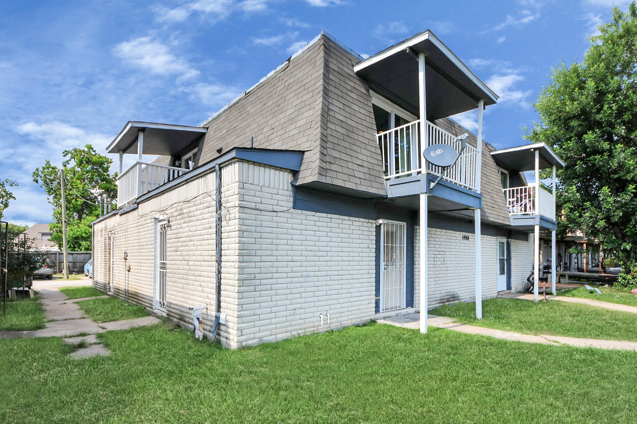 12068 Beechnut Street, Unit C Houston, TX 77072 - Photo 4 of 40 a front view of a house with a yard