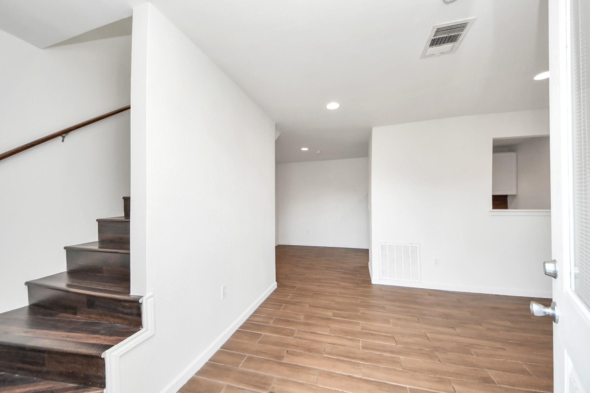12068 Beechnut Street, Unit C Houston, TX 77072 - Photo 7 of 40 a view of a hallway with wooden floor