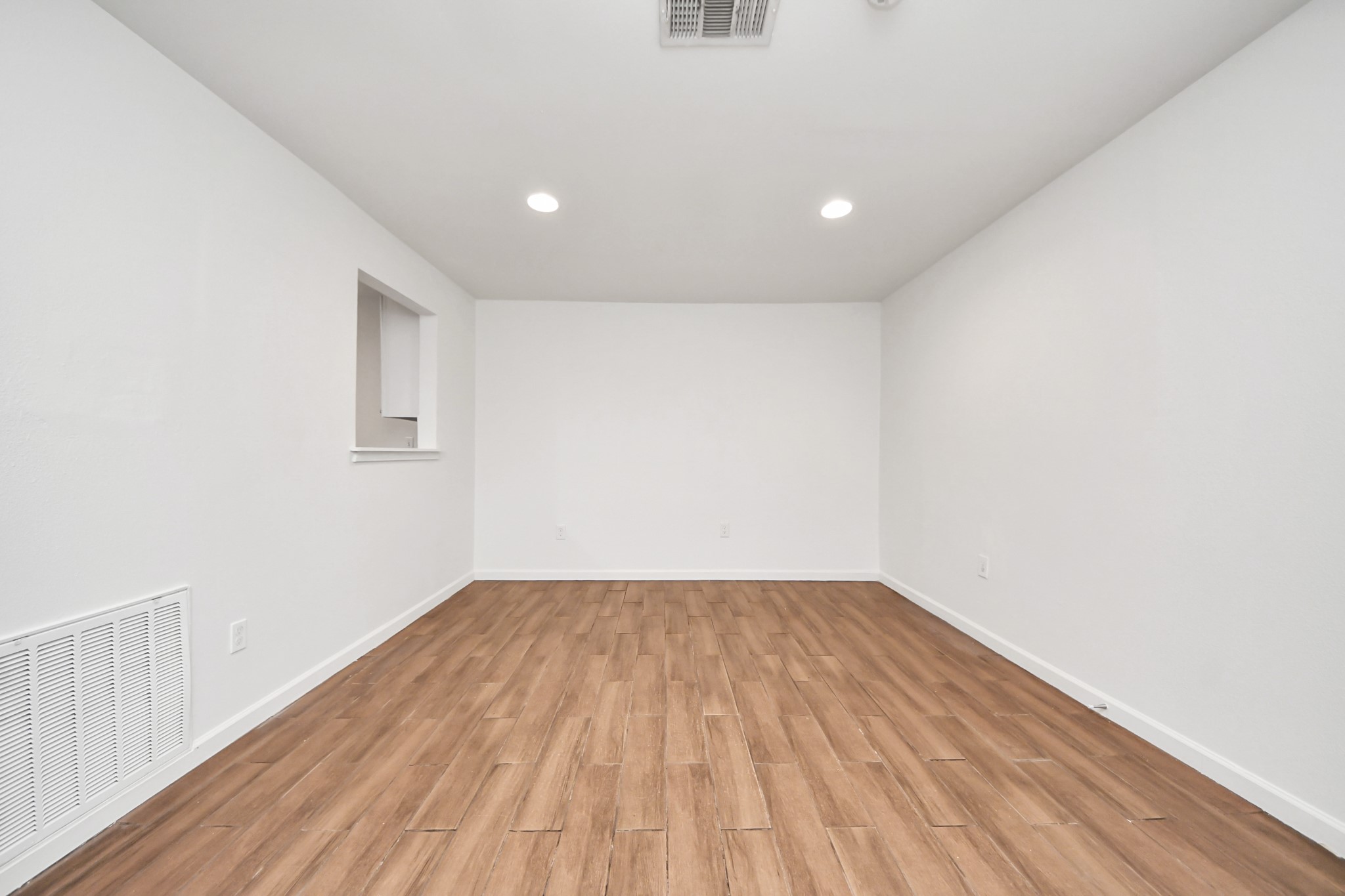 12068 Beechnut Street, Unit C Houston, TX 77072 - Photo 10 of 40 a view of empty room with wooden floor